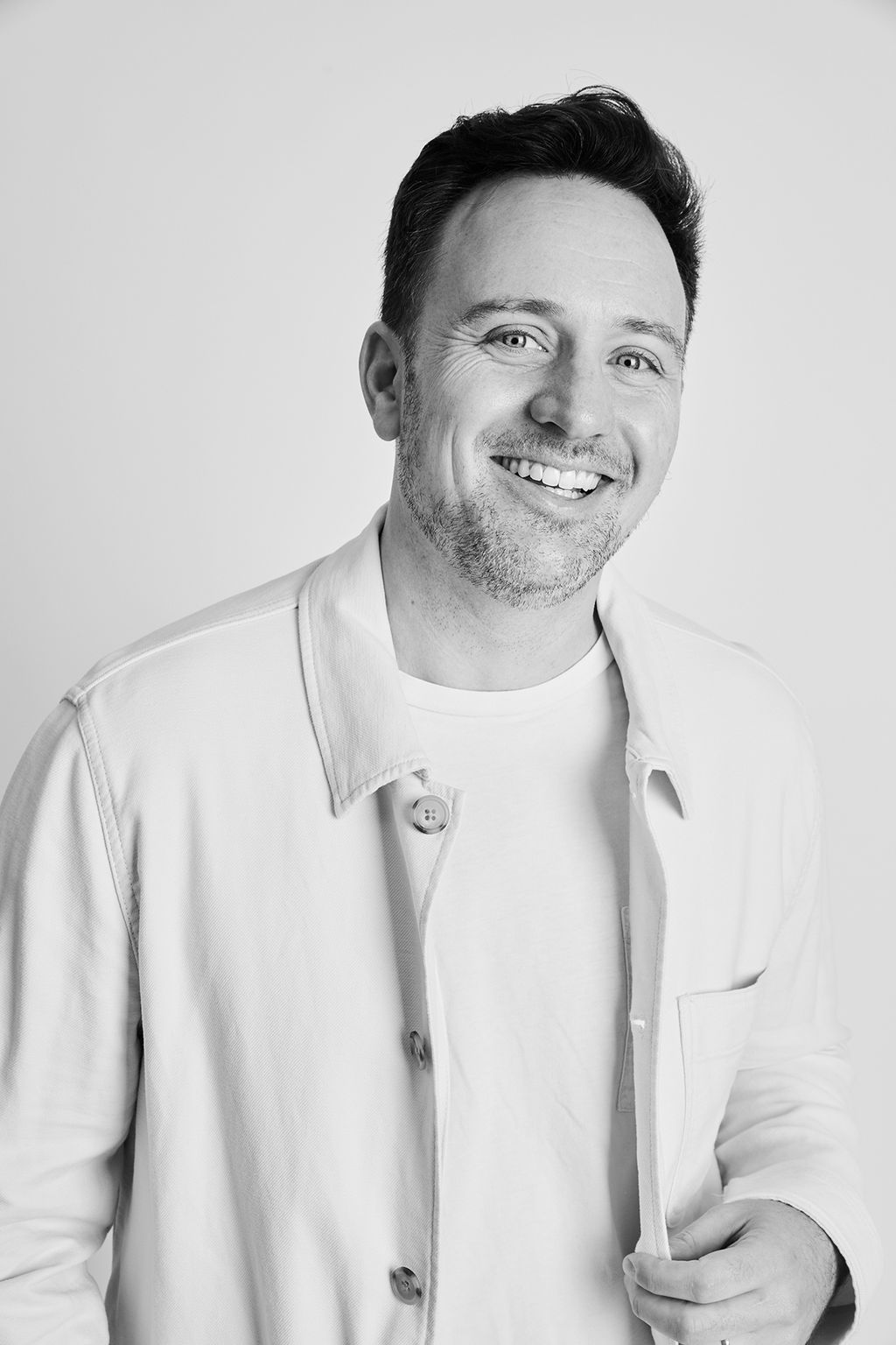 Portrait of Aaron Kagan in a workspace